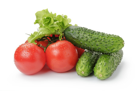 ripe tomato cucumbers and lettuce isolatedの写真素材