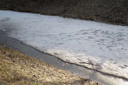 River in early spring covered with iceの写真素材