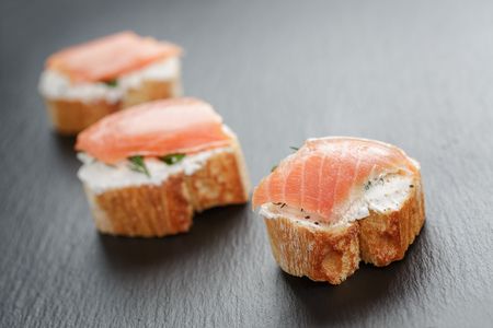small sandwiches with soft cheese and salmonの写真素材