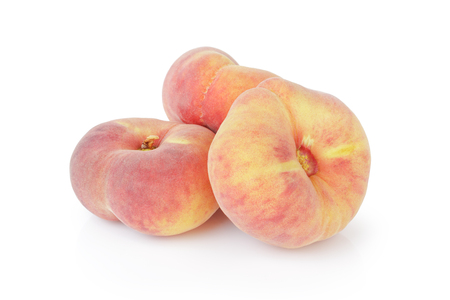 fresh asian flat peaches isolatedの写真素材