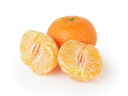 three ripe tangerines isolated on whiteの写真素材
