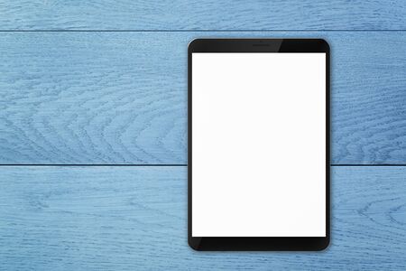 generic tablet pc on top of blue wooden tableの写真素材