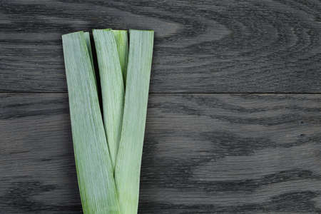 fresh organic leek on vintage oak tableの写真素材