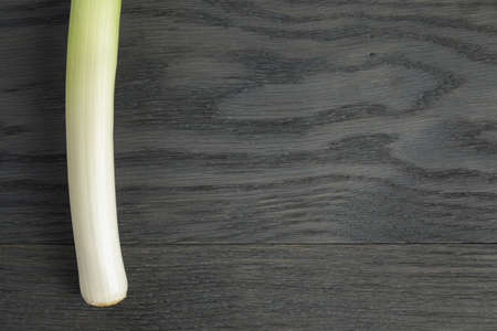 fresh organic leek on vintage oak tableの写真素材