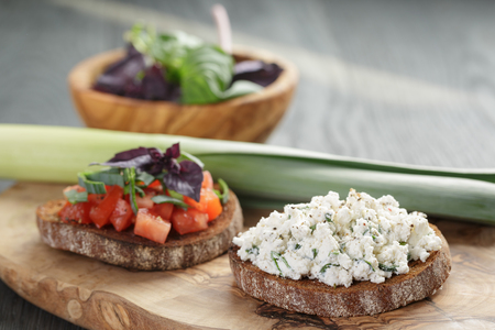homemade bruschetta with tomatoes, basil and leekの写真素材