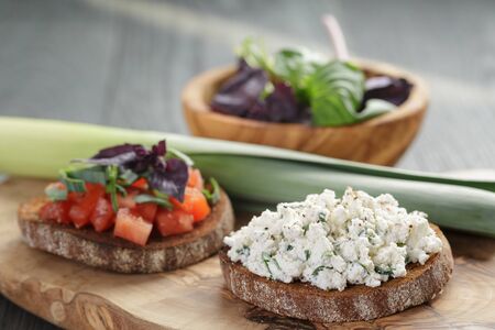 homemade bruschetta with tomatoes, basil and leekの写真素材