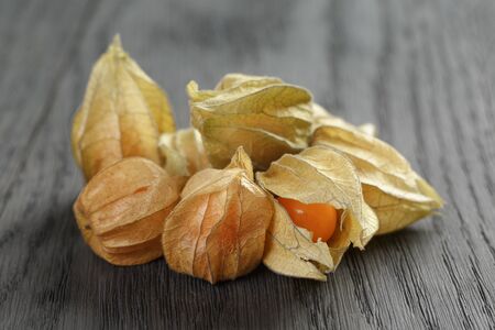 Physalis fruit on oak wooden tableの写真素材