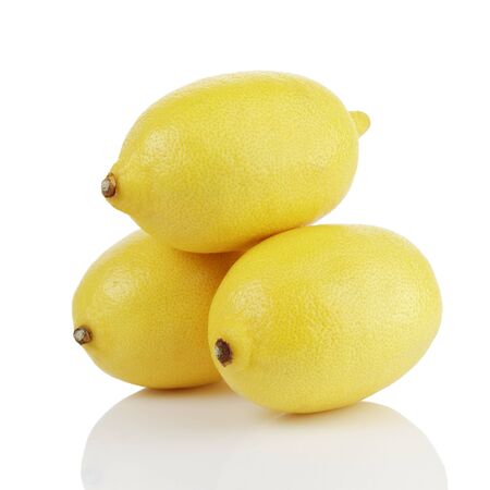 three fresh ripe lemons isolated on white backgroundの写真素材
