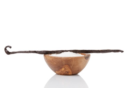 fresh bourbon vanilla pod and sugar, isolated on white backgroundの写真素材