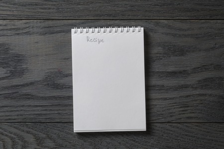 simple blank notepad with word recipe on rustic wood table, backgroundの写真素材