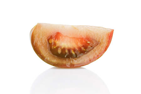 ripe kumato tomatoe segment isolated on white backgroundの写真素材