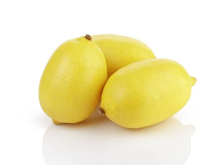 three fresh ripe lemons isolated on white backgroundの写真素材