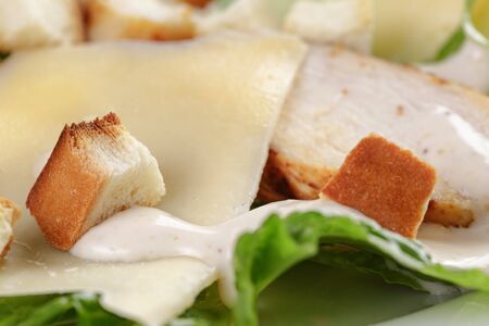 caesar salad with chicken romain and croutons, closeup photoの写真素材