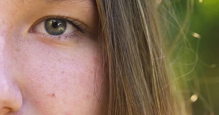 teenage girl face outdoor close up footage, 4k photoの写真素材