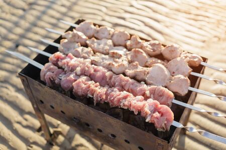 preparing shashlik on the beach, close up photoの写真素材