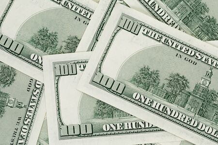 hundred dollars notes background, closeup with shallow focus