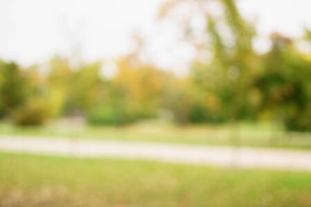 blurred bokeh background of autumn parkの写真素材