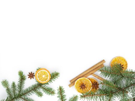 fir twig with dried orange slice on white background, christmas backdropの写真素材