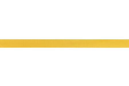 yellow gift ribbon for composition, isolated on white backgroundの写真素材