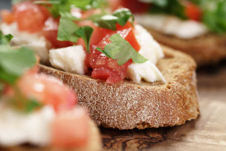 rye bruschetta with mozzarella, tomatoes and parsley, selective focusの写真素材