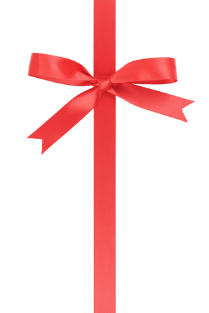 vertical red ribbon with bow from above, isolated on whiteの写真素材
