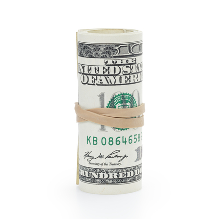 roll of 100 dollar banknotes tied with elastic band isolated on white background.の写真素材