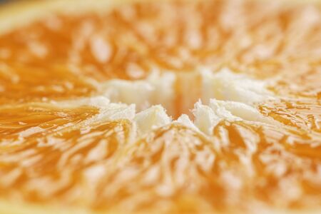 half of ripe orange closeup, shallow focusの写真素材
