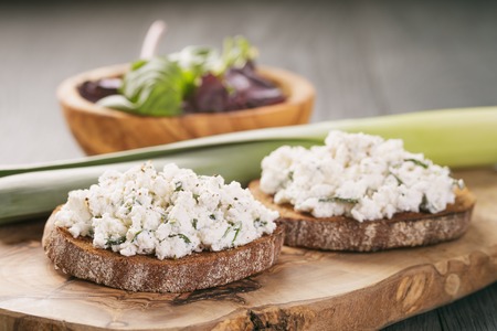 two rye sandwich or bruschetta ricotta and herbsの写真素材