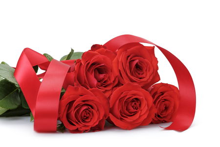 five bright red roses isolated on white backgroundの写真素材