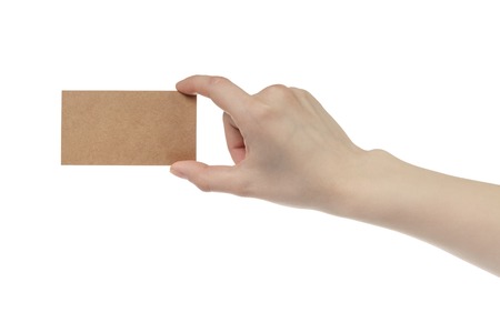 young female right hand hold blank brown paper card, isolated on whiteの写真素材