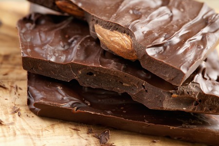 homemade chocolate with almond nuts on wood table, shallow focusの写真素材