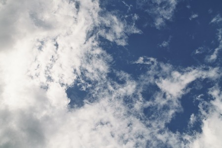 blue sky with dramatic clouds, puffy fluffy clouds