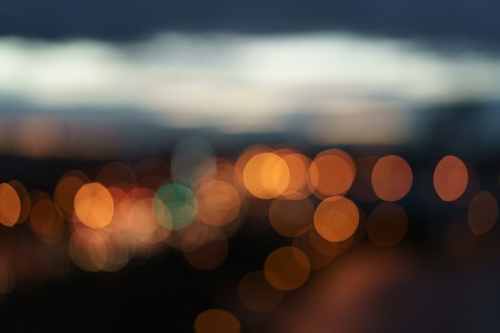 abstract bokeh blurred night city background from above, urban backdropの写真素材