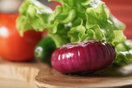 raw vegetables on kitchen table, ingredients for burgerの写真素材