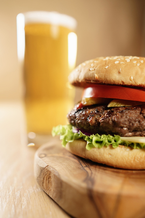 homemade hamburger with beer on background, shallow focusの写真素材