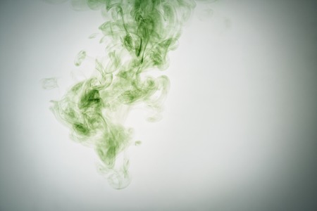 green ink poured in water, copy space for your infoの写真素材