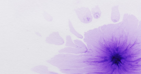 purple watercolor paint spot on white paperの写真素材