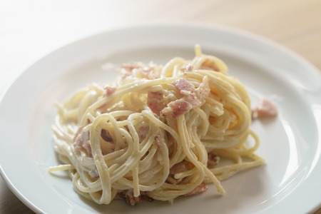 fresh homemade spaghetti carbonara with smoked bacon, shallow focusの写真素材