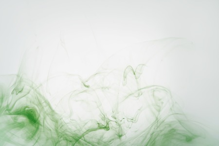 green ink poured in water, copy space for your infoの写真素材