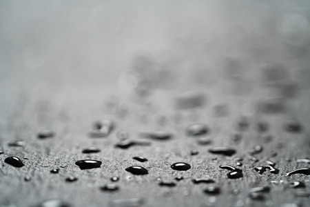 slate surface with water drops macro shot, shallow focusの写真素材
