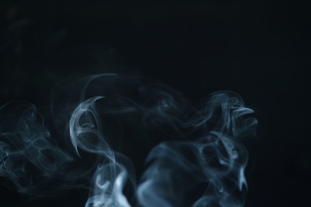 real blue smoke over black background, abstract backdropの写真素材