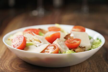 fresh homemade caesar salad with chicken, shallow depth of fieldの写真素材