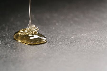 natural honey pour on slate board, with copy space