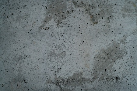 rough grey grungy concrete background, focus in the middle of frameの写真素材