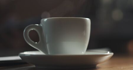 steam rising from espresso cup with fresh hot coffee shallow focus, 4k photoの写真素材