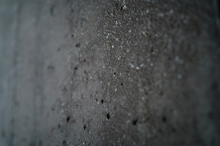 rough grey grungy concrete background, focus in the middle of frameの写真素材