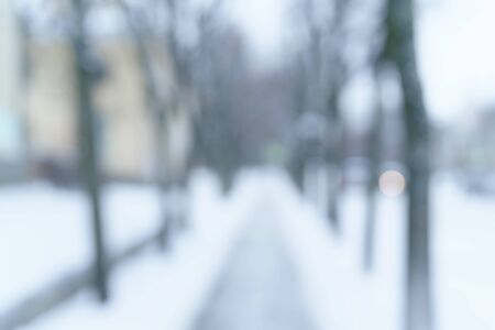 blurred background of town sidewalk in winter, natural blurの写真素材