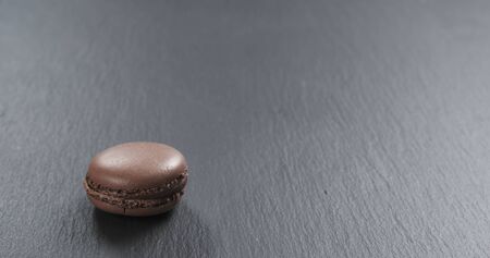 chocolate macaron on slate board, 4k photoの写真素材