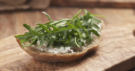 arugula on rustic bread with ricotta cheese, 4k photoの写真素材