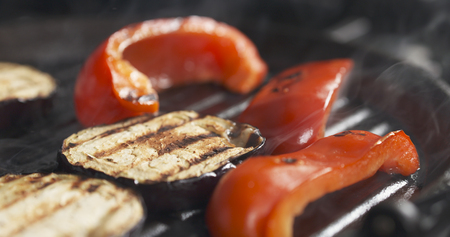 cooking eggplant and pepper on grill pan, wide photoの写真素材